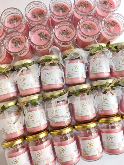 An order of 50 pink jar candles with lavender toppings, personalized with an 'SV' logo for a wedding in Patna.