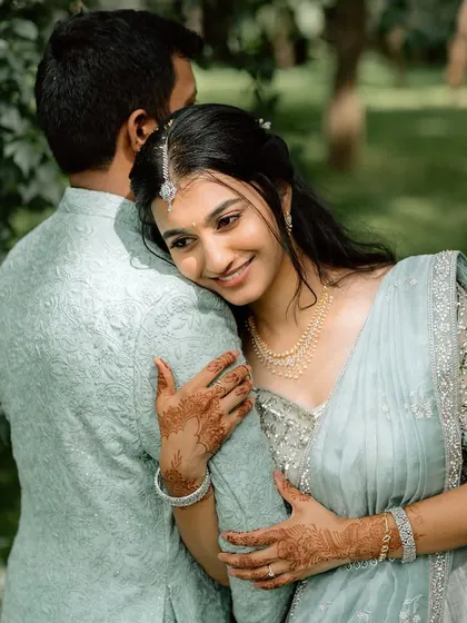 A sweet, candid moment. The makeup is natural and enhances her happy glow.