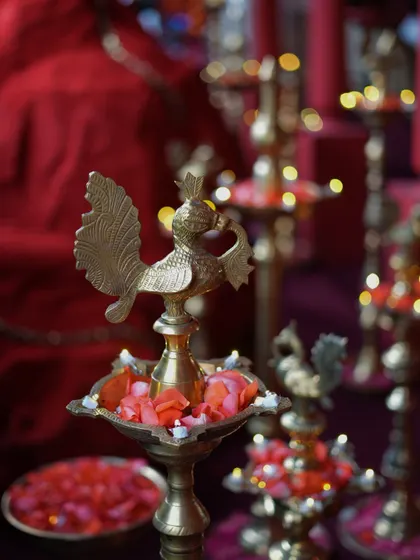 A beautiful brass peacock diya, a traditional Indian lamp that adds an element of artistry and light to the decor.