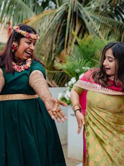 Happy brides are the prettiest! A candid moment of laughter and dance during the mehndi festivities.