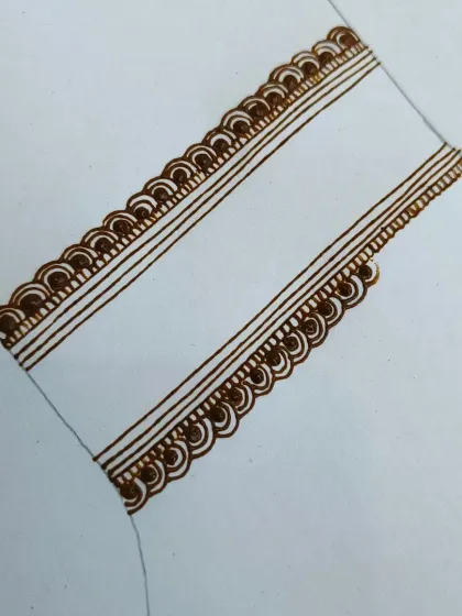 A very basic border practice. Even the simplest patterns, like these scalloped edges, need to be clean and consistent. We start here before moving to more complex elements.