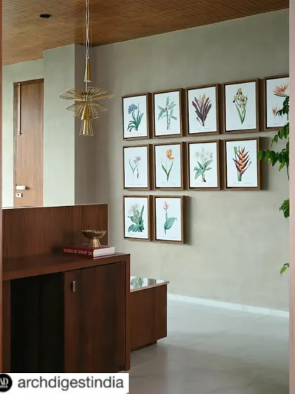 Another shot from the Architectural Digest feature, highlighting the gallery wall and custom woodwork at the entrance of the executive suite. This press feature underscores the project's design excellence.