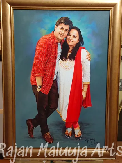 A beautiful couple portrait, sized 2 by 3 feet, painted with acrylic on canvas. The vibrant red attire and the warm embrace make this a lively and heartfelt piece.
