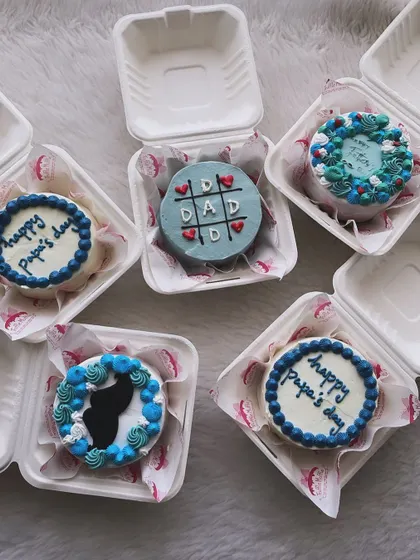 A collection of different bento cake designs for Father's Day. You can see the variety, from simple messages to fun themes like tic-tac-toe.