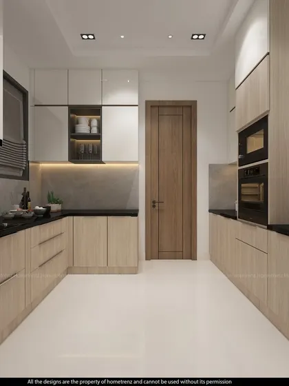A full view of a U-shaped kitchen, demonstrating ample storage and counter space. The combination of wood and white finishes is a classic choice for a warm and inviting kitchen.