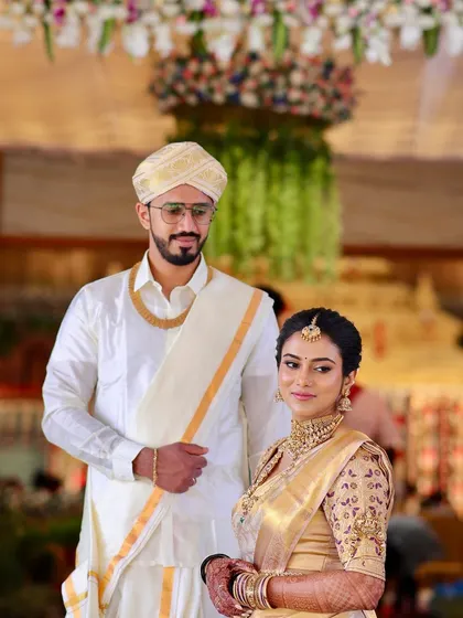 The complete bridal look for Pranitha and her groom. Her minimalist makeup and traditional attire create a picture of pure elegance for their wedding day.