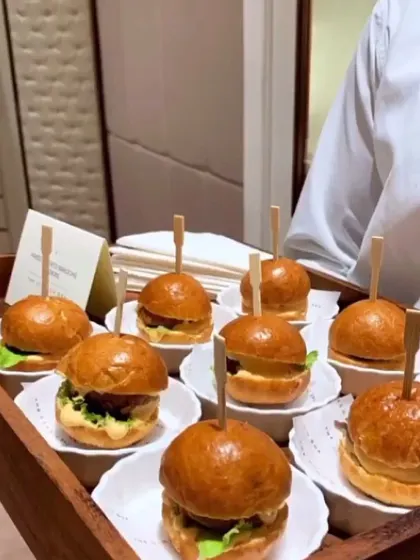 My veg mini burger sliders are perfect for parties. Served on a tray, these bite sized burgers are easy for guests to enjoy while mingling.