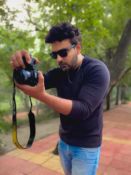 Caught in the act of checking my shot. I’m deeply involved in every detail on set to make sure the final image is perfect.