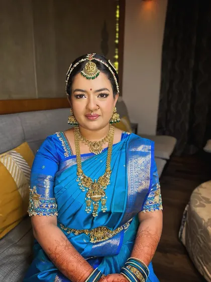 For this beautiful Iyengar bride, I focused on a subtle and classic look. The makeup enhances her features with soft tones and a flawless finish, allowing the magnificent blue Kanjivaram saree and traditional jewellery to take center stage.