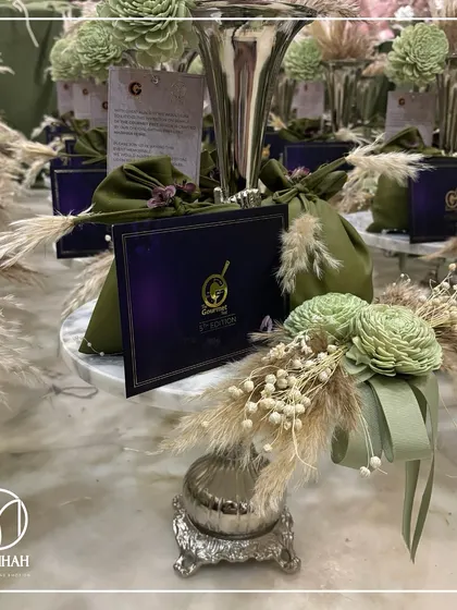 A wide shot of the multiple invitations created for The Gourmet Fest, showcasing a consistent theme of rustic elegance and luxury.