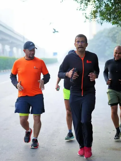 The coach running alongside a tribe member. I lead from the front and am deeply involved in every runner's journey.