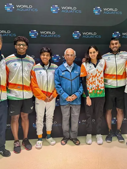 Team India at the World Aquatics in Doha, featuring our swimmers and head coach Pradeep Kumar.