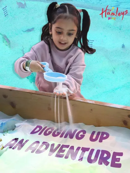 Digging up an adventure! The sand pit is a magical place where imaginations run wild, whether they're building castles or searching for buried treasure.