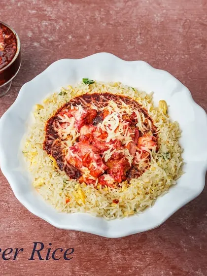 An off-menu special, the Al Safeer Rice is a unique creation featuring rice and a tangy gravy, loaded with our chef's special starter chicken and garnished with cheese.
