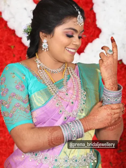 A candid shot of the bride, showing the beautiful details of her jewellery and saree.