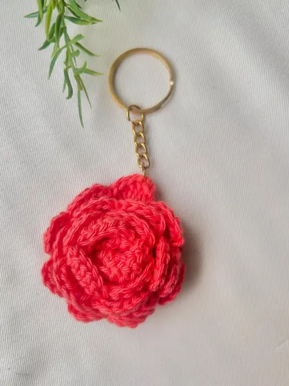 A single, perfect coral rose keychain. It’s lightweight and the bright color makes it easy to spot your keys.