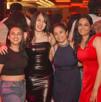 A group of ladies enjoying their night out with great music and good company.