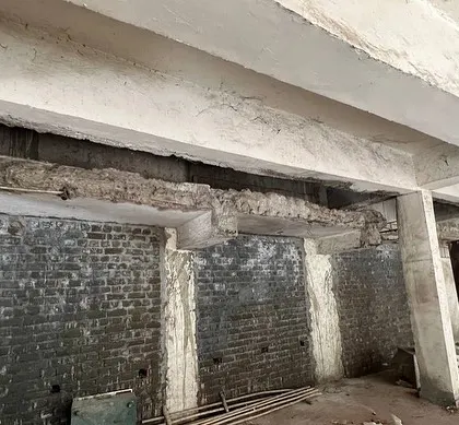 A look at the original exposed beams and brickwork. Our challenge was to integrate modern services like central air conditioning within the existing, restrictive structure.