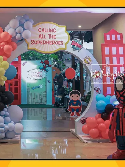 The grand entrance to a superhero party, "Calling All Superheroes." We used character cutouts and a colorful balloon arch to build excitement from the moment guests arrived.