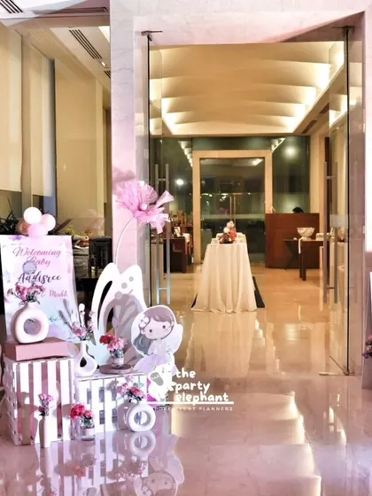 The entrance to the butterfly fairy baby welcome party, showing the elegant decor that greets guests. We combine personalized signage with themed props to set a magical tone from the start.