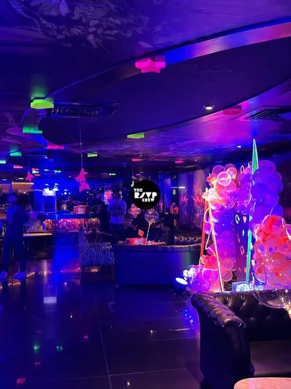The entire venue was transformed into a neon wonderland, with glowing elements on the ceiling and tables, creating an electric atmosphere.