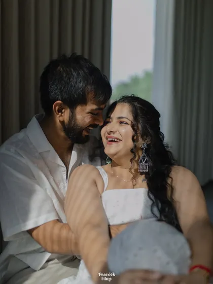 Pure, unscripted laughter. This candid pre-wedding shot captures the joy and playfulness in the couple's relationship, a beautiful memory of their time together.