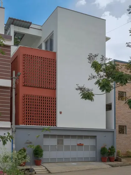 The Kadambini Residence features a bold, dynamic brick facade that stands in minimalist contrast to its surroundings. This design choice was central to the home's character, creating a visually striking exterior that filters light and ensures privacy.