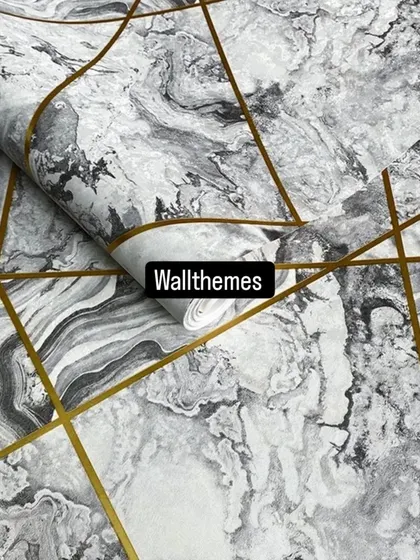 A classic black and white marble-effect wallpaper with a contemporary geometric pattern in gold.