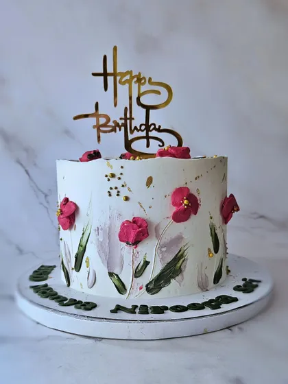 A beautiful floral cake with hand-painted buttercream flowers. This 2kg chocolate nutella cake is a work of art, perfect for a sophisticated celebration.
