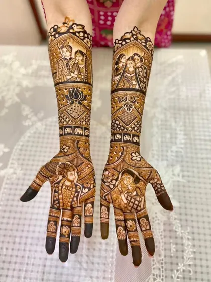A family portrait in henna. This design for my bride Ruchi features her family, along with traditional elephant and bird motifs, symbolizing strength and grace.