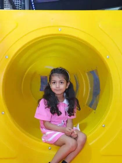 A perfect photo opportunity inside one of our play structure's colorful tunnels.