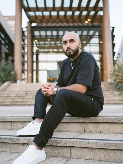 Sitting on the steps, taking a moment between events. The DJ life is a grind, but it's incredibly rewarding.