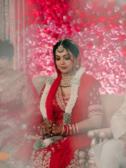 "Behind the veil, beyond the pose." This is a moment of pure, unfiltered emotion, capturing the bride's serene beauty and quiet contemplation on her wedding day.