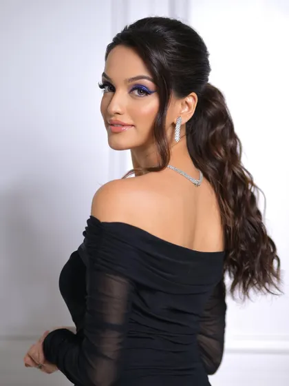 A confident and glamorous portrait that perfectly captures the essence of a modern party look.