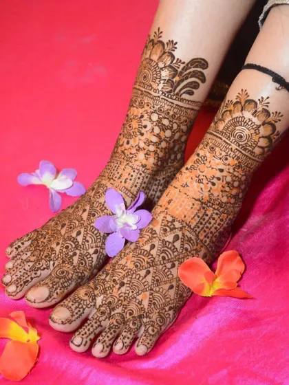 Beautifully detailed bridal mehndi for the feet. The intricate patterns cover the feet completely, which is a traditional and essential part of the complete bridal look.