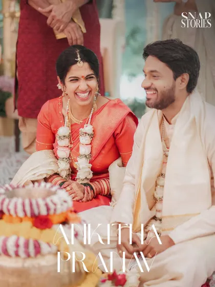 A happy moment during a South Indian wedding ceremony. The genuine smiles of the couple are the focus of this candid shot.