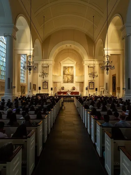 A full view of the sold-out 'Sitar for Mental Health' show in a beautiful church, demonstrating the universal appeal of this meditative experience.