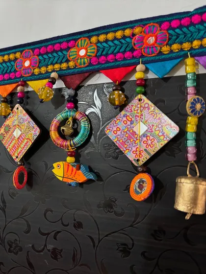 A final look at 'The Summer Song' Toran before it was packed up. The mix of my psychedelic prints on the kite shapes with the bright primary colors feels so cheerful.