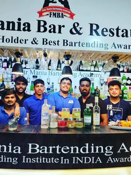 A group of students behind the bar at our award-winning institute, ready for their practical session.