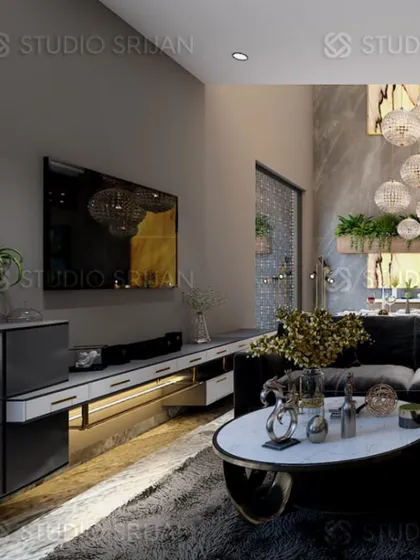 A TV lounge area in Varanasi, designed for entertainment with a large screen and comfortable seating. The lighting design adds to the cinematic feel.