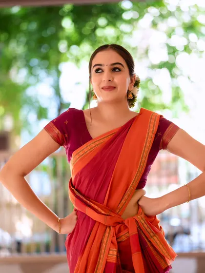 A playful and confident pose. This shot has a wonderful energy and shows a different side of the traditional look.