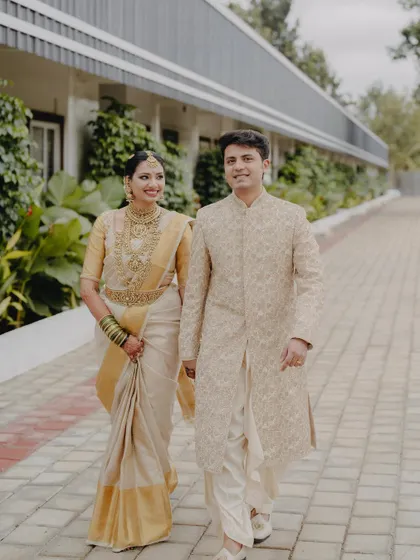 A beautiful shot of the couple walking together, their coordinated outfits creating a harmonious and elegant picture.