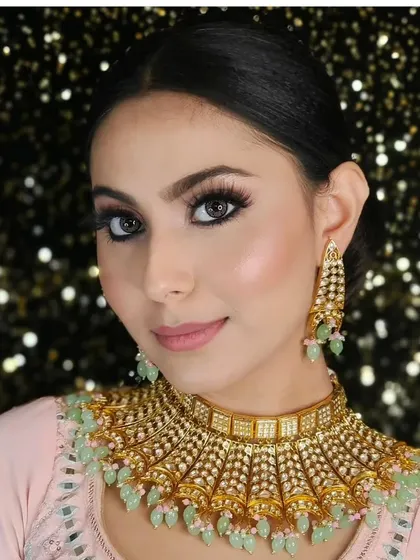 A close-up of a beautiful choker with light green beading, perfect for a subtle and elegant look for a sangeet or engagement ceremony.