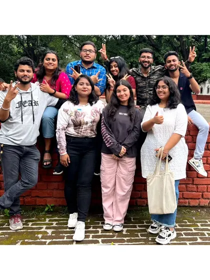 A duplicate of the whole crew posing on a brick wall at Aga Khan Palace. The grounds were beautiful to explore.