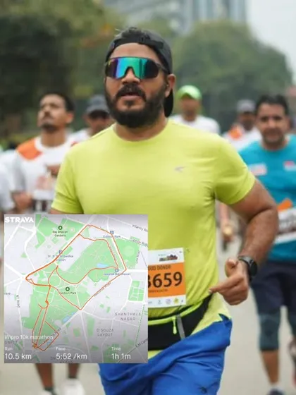 This client is pictured during a 10k race. The combination of running and a tailored strength program leads to improved performance and enjoyment of the sport.