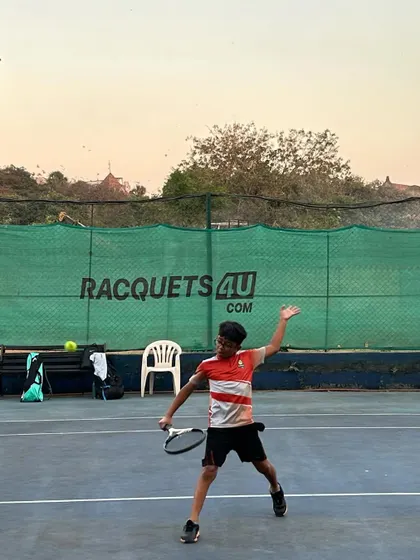 A player demonstrates a powerful and athletic forehand during a drill, capturing the intensity of our training.