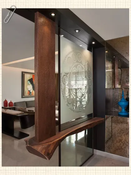 In the Modi Residence, we used a mix of materials to create a rich, layered entryway. A floating wooden bench is anchored to a structural pillar, and a Sanjhi-inspired glass screen provides both privacy and artistry.