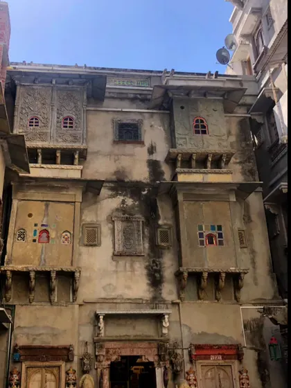 The full facade of a historic haveli, with its many jharokhas and carved details. This architectural richness informs our understanding of scale, proportion, and ornamentation in residential design.