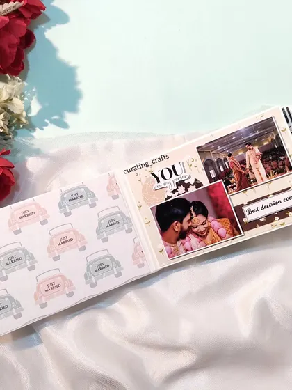 An inside page of the anniversary mini scrapbook, with photos from the couple's wedding.