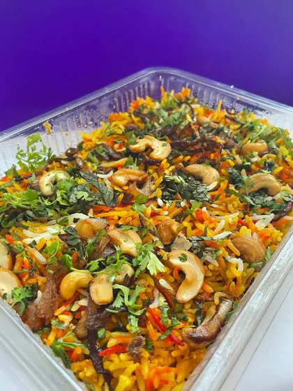 Another angle of the delicious vegetable biryani, showcasing the vibrant colors and fresh ingredients.